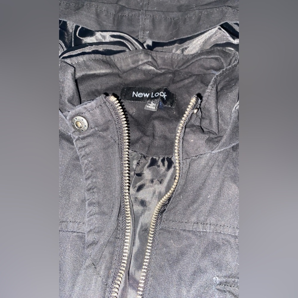 Brand New look , size large first more like a medium. Color black.